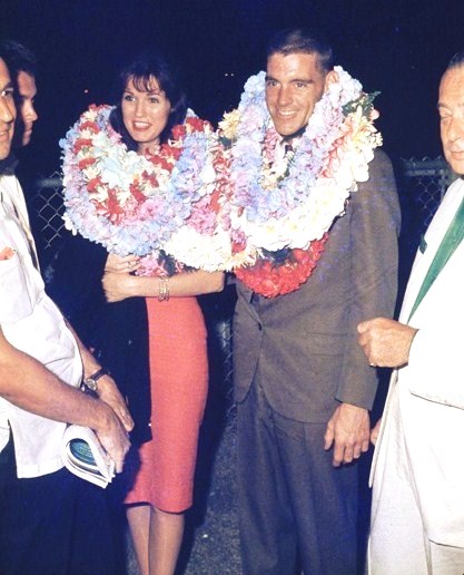 Racer Dave MacDonald and wife Sherry with Hawaiian Grand Prix race officials 1963